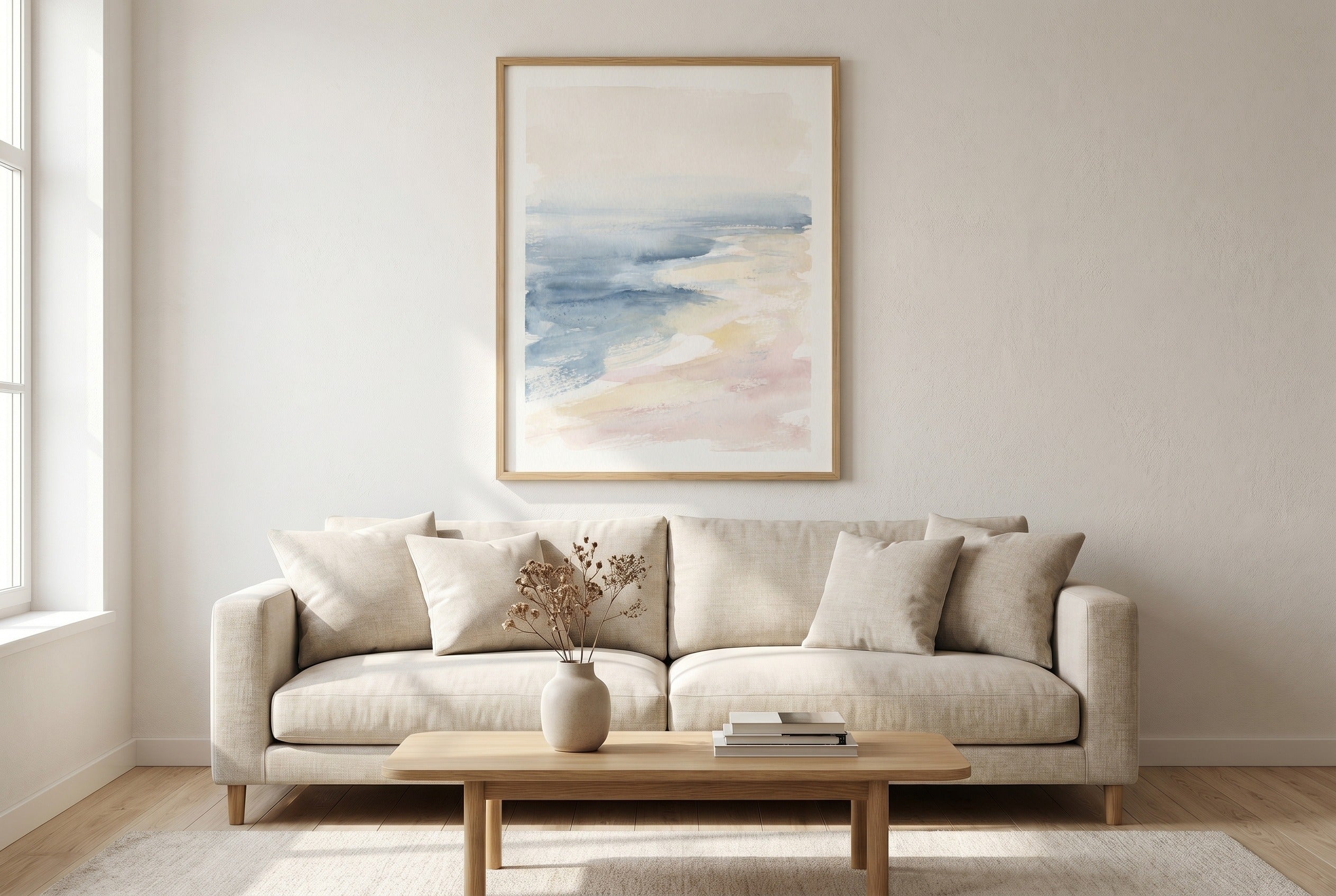 A beautifully styled short-stay living room with one large art piece above the sofa